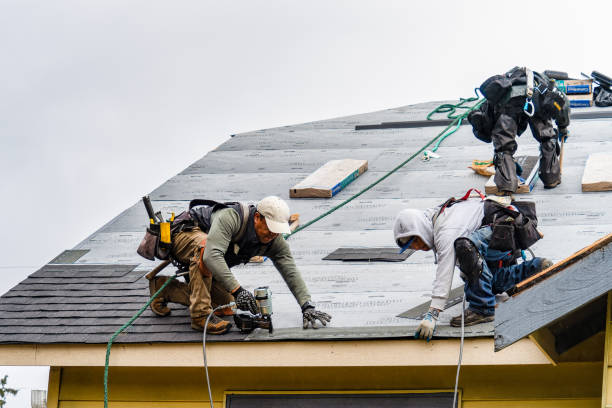 Professional Storm Damage Roof Repair technician working in North Scituate, RI